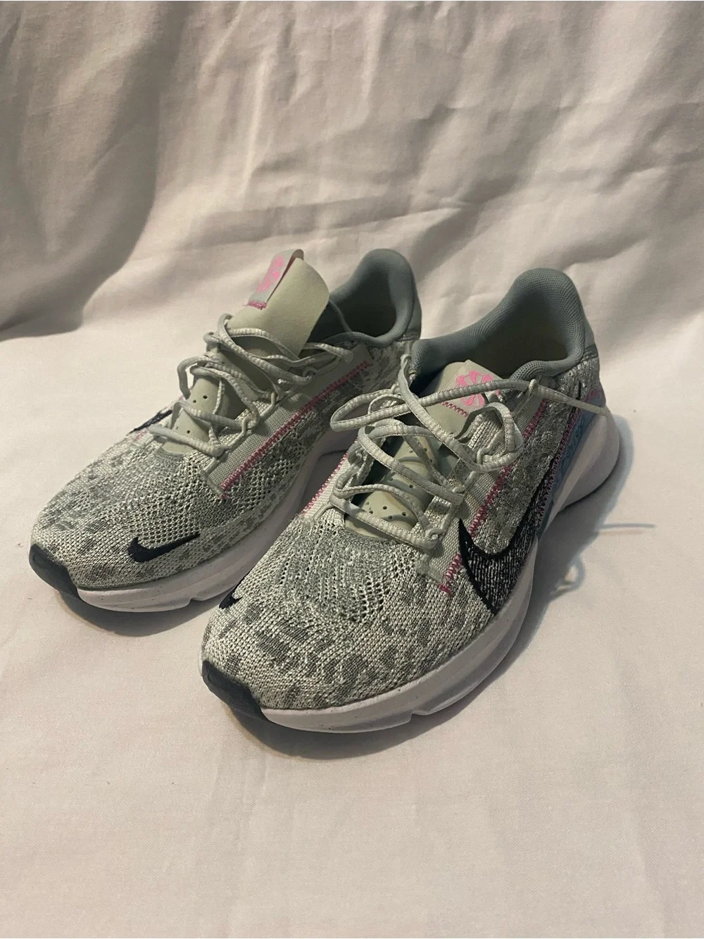 Nike Women's Grey Knit Running Shoes with Pink Accents